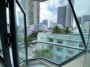 a view from the window of a building at Hoang Hoa Tham Apartment in Nha Trang