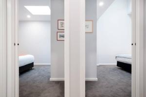 a bedroom with two beds and a window at The Ranch In The Heart Of Launceston w/ Free Wifi in Launceston