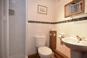 a bathroom with a toilet and a sink at No9 Budle Sands in Bamburgh +20 photos