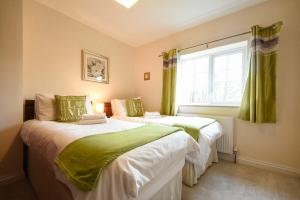 Säng eller sängar i ett rum på Castle View Warkworth