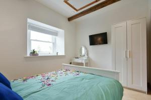 Katil atau katil-katil dalam bilik di Christon Well Cottage