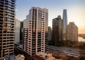 a view of a city skyline with tall buildings at Quay West 1301 Self- Catering in Sydney