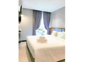 Postel nebo postele na pokoji v ubytování Narawad Boutique Hotel