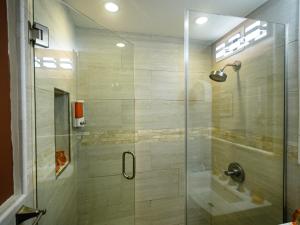 a shower with a glass door in a bathroom at Perfect DTWN 2 Bed Condo with Cali King Bed and Gym in Atlanta