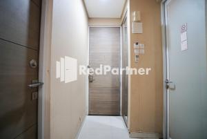 Koupelna v ubytování Tirta Mansion Lippo Karawaci Mitra RedDoorz