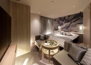 Ένα ή περισσότερα κρεβάτια σε δωμάτιο στο Hotel Cocoon -Urban Luxury-