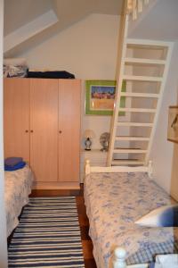 En eller flere senge i et værelse på Villa Linnunlaulu
