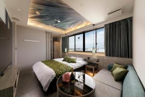 Ένα ή περισσότερα κρεβάτια σε δωμάτιο στο Hotel Cocoon -Urban Luxury-