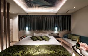 Ένα ή περισσότερα κρεβάτια σε δωμάτιο στο Hotel Cocoon -Urban Luxury-
