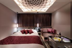 Ένα ή περισσότερα κρεβάτια σε δωμάτιο στο Hotel Cocoon -Urban Luxury-