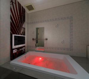 Μια τηλεόραση ή/και κέντρο ψυχαγωγίας στο Hotel Cocoon -Urban Luxury-