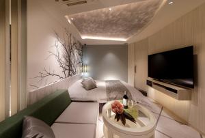 Μια τηλεόραση ή/και κέντρο ψυχαγωγίας στο Hotel Cocoon -Urban Luxury-