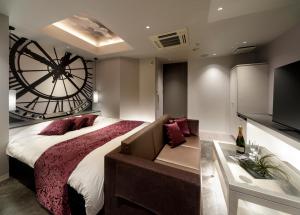 Ένα ή περισσότερα κρεβάτια σε δωμάτιο στο Hotel Cocoon -Urban Luxury-
