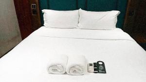 Postel nebo postele na pokoji v ubytování Narawad Boutique Hotel