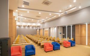 a large conference room with tables and chairs at POP! Hotel Banjarmasin in Banjarmasin