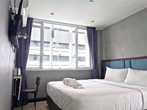 Postel nebo postele na pokoji v ubytování Narawad Boutique Hotel