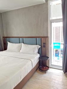 Postel nebo postele na pokoji v ubytování Narawad Boutique Hotel