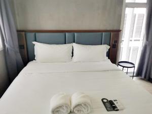 Postel nebo postele na pokoji v ubytování Narawad Boutique Hotel