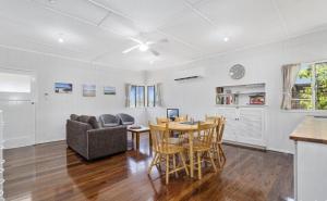 a kitchen and living room with a table and chairs at Relax on Rickman in Woorim