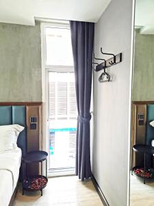 Postel nebo postele na pokoji v ubytování Narawad Boutique Hotel