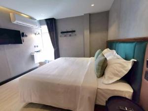 Postel nebo postele na pokoji v ubytování Narawad Boutique Hotel