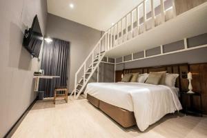 Postel nebo postele na pokoji v ubytování Narawad Boutique Hotel + 37 fotografií
