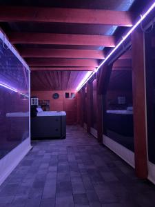 a room with two beds and purple lights at SunStar in Rewal