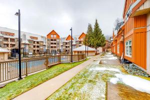 a street in a residential neighbourhood with houses at Lake Placid Coach House 17 in Whistler