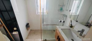 a bathroom with a shower and a sink at Top floor sunny bedroom near Fudan in Shanghai