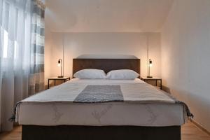 Postel nebo postele na pokoji v ubytování Apartman UMA