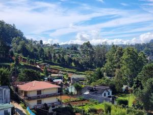 an aerial view of a small village in the mountains at La Rose Guest House in Nuwara Eliya
