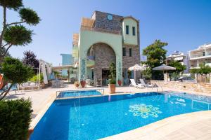 a swimming pool in front of a building at Villa Anthelion in Limenaria