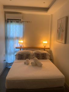 Postel nebo postele na pokoji v ubytování Puntakana Apartelle Cosy Apartment Panglao
