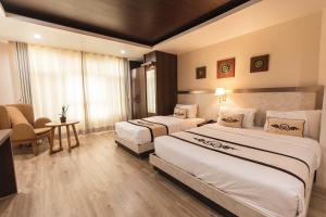 Tempat tidur dalam kamar di Lavie Residence and Spa