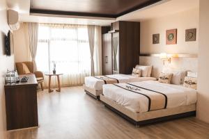 Tempat tidur dalam kamar di Lavie Residence and Spa