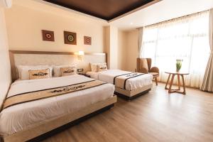 Tempat tidur dalam kamar di Lavie Residence and Spa