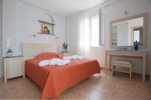Letto o letti in una camera di Aigaio Studios tinos