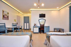Postel nebo postele na pokoji v ubytování Royal Park Resort Boracay