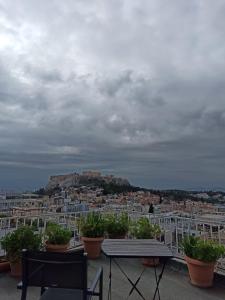 a view of a city from the roof of a building at Mosaics Athens easystay in the Historical centre in Athens