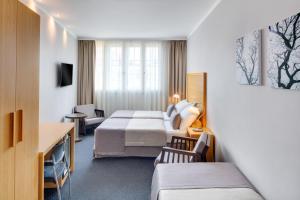 Voodi või voodid majutusasutuse Hotel Clement toas