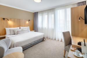 Voodi või voodid majutusasutuse Hotel Clement toas