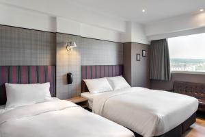 Krevet ili kreveti u jedinici u okviru objekta River Inn Kenting