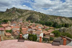 a view of a town with a mountain at La casita de El Cuervo in El Cuervo