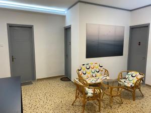 a room with two chairs and a table and two chairs at Sunset view Rooms in Agia Triada +37 photos