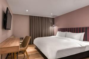 Krevet ili kreveti u jedinici u okviru objekta River Inn Kenting