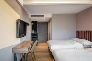 Krevet ili kreveti u jedinici u okviru objekta River Inn Kenting