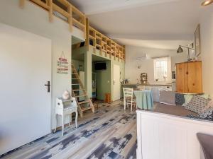 a living room and kitchen with a loft conversion at Gite l'Odonate, partage des eaux in L'Isle-sur-la-Sorgue