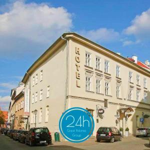 a building with a hotel sign in front of it at Great Polonia Kraków Old Town in Krakow