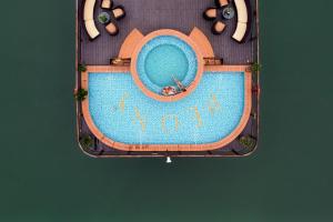 an overhead view of a swimming pool with a clock at Peony Cruises in Ha Long