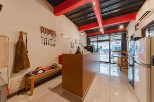 a kitchen with a counter in a room at RedDoorz near UNSIKA University Karawang in Karawang